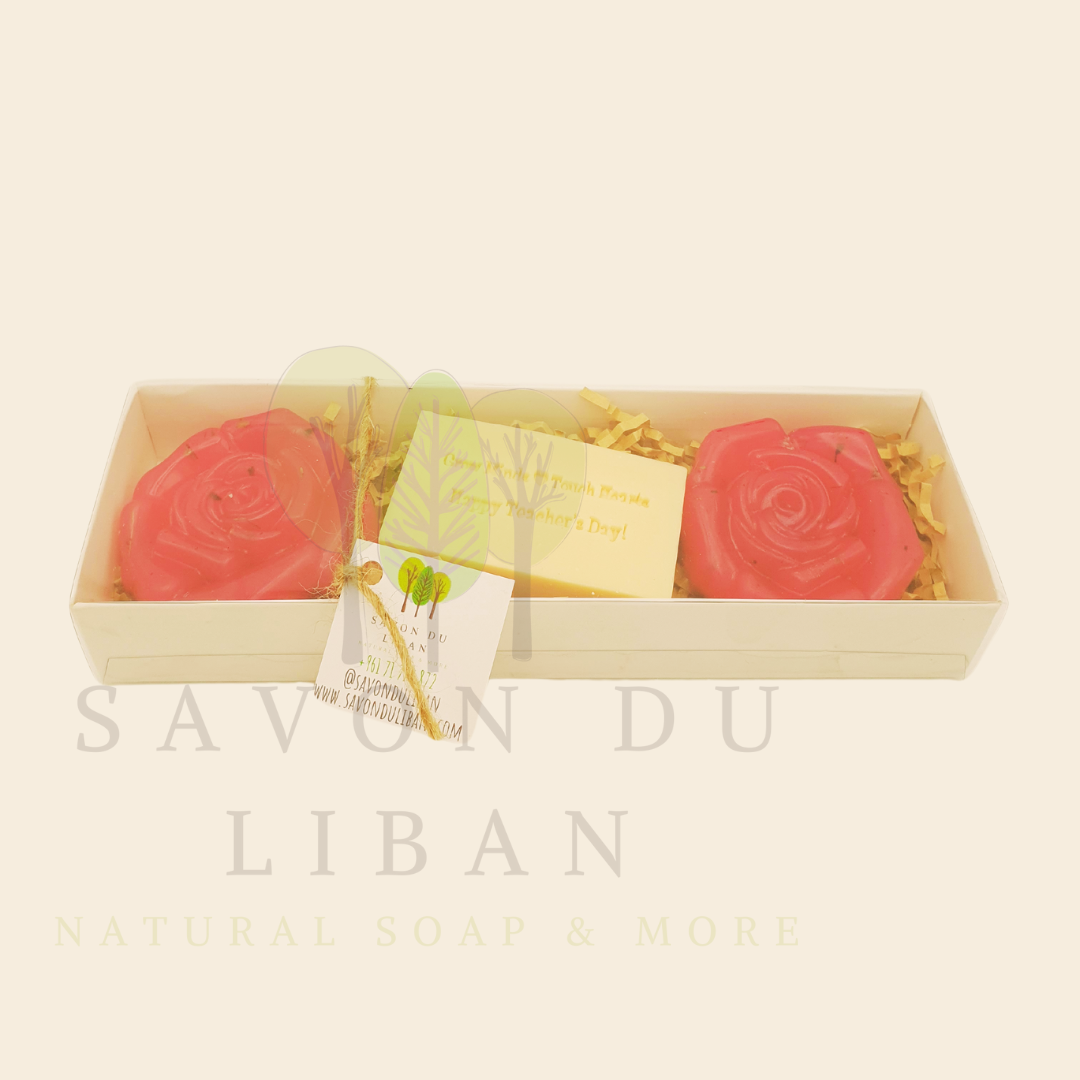 A Teacher’s Scent-sational Petals – The 2025 Teacher's Day Floral Gift Set with a Musk soap stamped 'Grow Minds ❤️ Touch Hearts - Happy Teacher's Day!' and two scented flower-shaped soaps in an elegant 23x8x3.5 cm box with transparent cover.