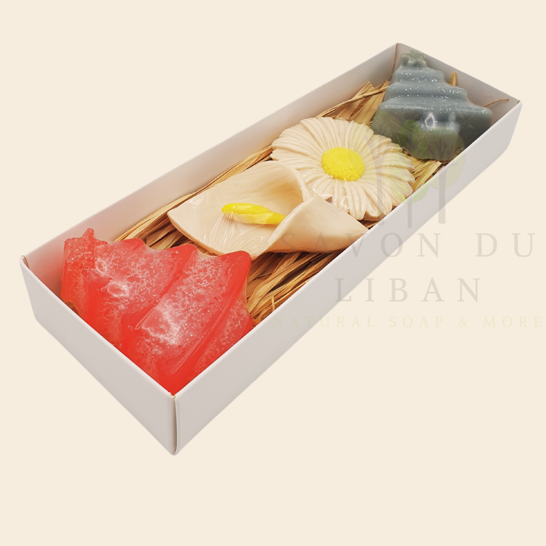 Christmas Garden Soap Set with festive Christmas tree, snowflake, daisy, and lily soaps, in a sleek white box.