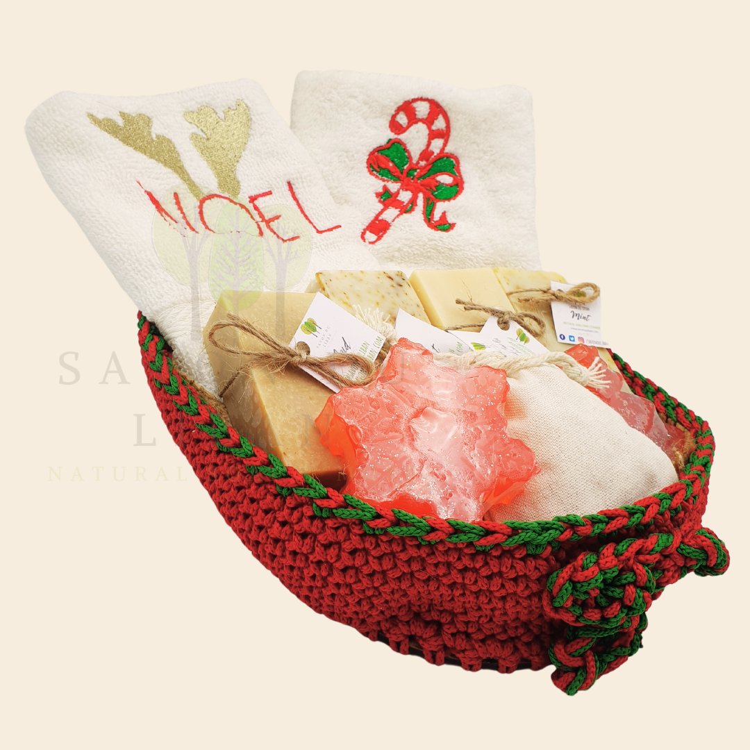 Christmas Stitches of Love, handcrafted red and green crochet platter with festive embroidered towels and artisan soaps like Snowflake and Christmas tree-shaped soaps.