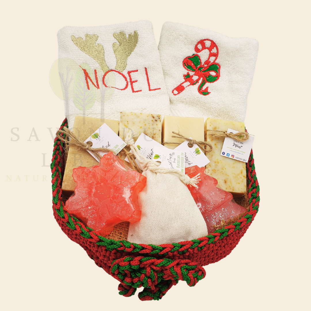 Christmas Stitches of Love, handcrafted red and green crochet platter with festive embroidered towels and artisan soaps like Snowflake and Christmas tree-shaped soaps.