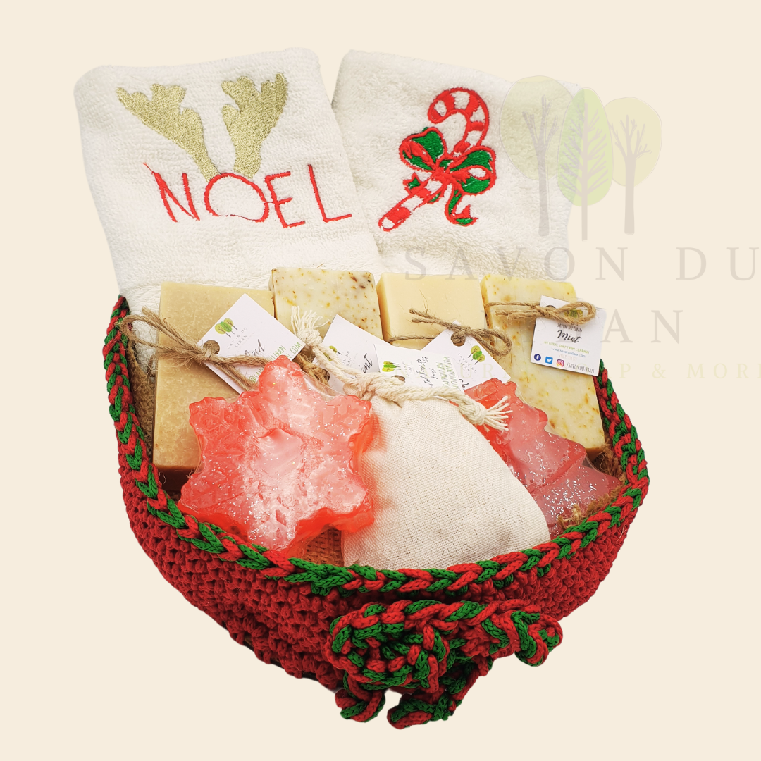 Christmas Stitches of Love, handcrafted red and green crochet platter with festive embroidered towels and artisan soaps like Snowflake and Christmas tree-shaped soaps.