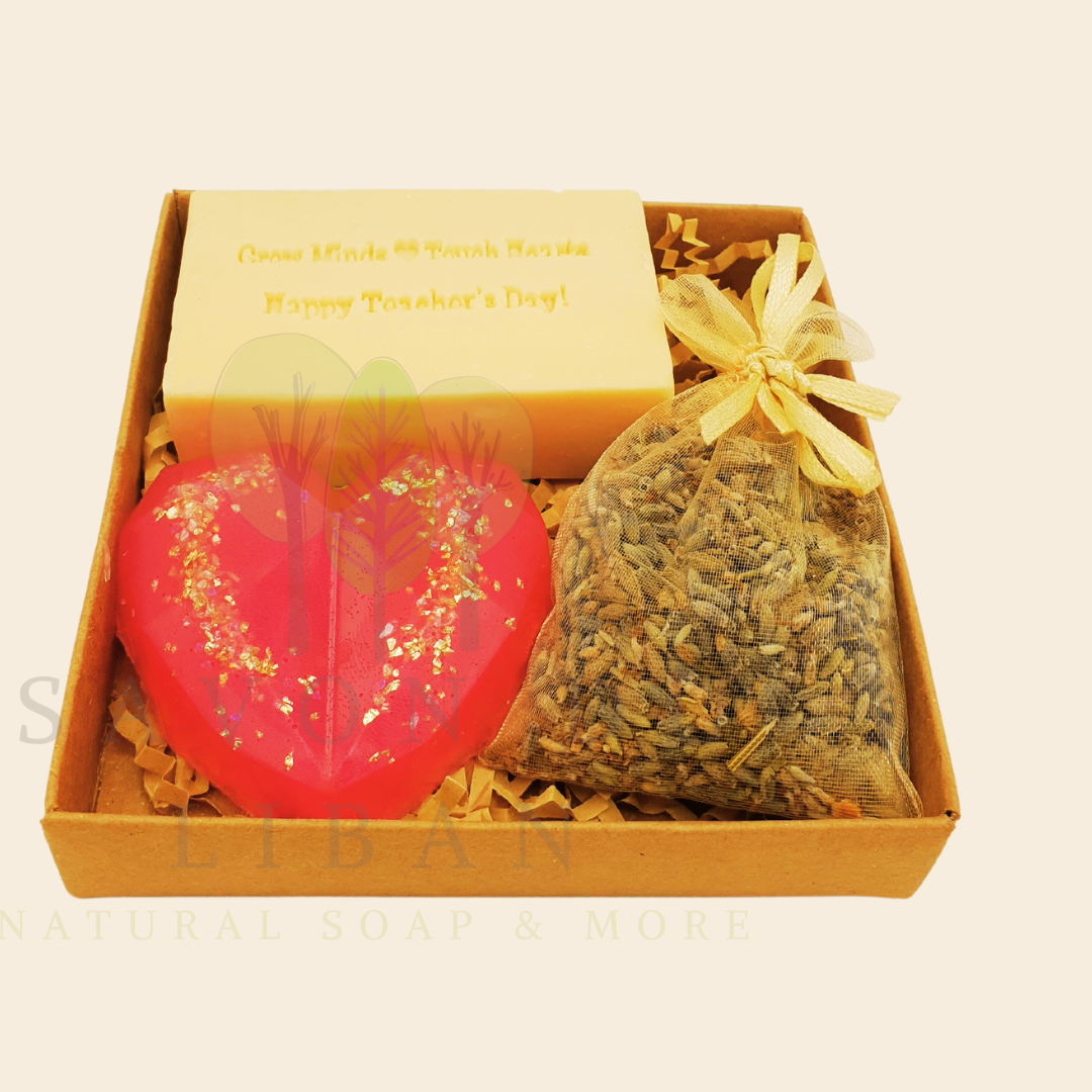 Teacher’s Relax & Enjoy Set – Stamped soap 'Grow Minds ❤️ Touch Hearts - Happy Teacher's Day!', heart soap, and lavender bag in a 11x11x2.5 cm craft box with transparent cover.