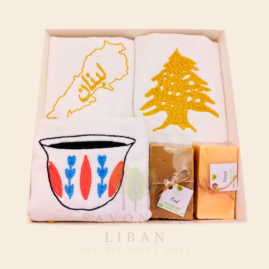 Good Morning from Lebanon – cultural gift set including embroidered towels with Cedar Tree, Lebanon Map, and Coffee Cup Motifs and 2 Handmade Soap Bars in a square white box with transparent lid.