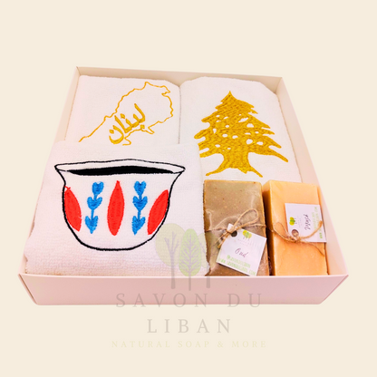 Good Morning from Lebanon – cultural gift set including embroidered towels with Cedar Tree, Lebanon Map, and Coffee Cup Motifs and 2 Handmade Soap Bars in a square white box with transparent lid.