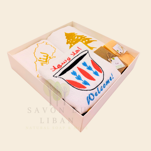 Good Morning from Lebanon – cultural gift set including embroidered towels with Cedar Tree, Lebanon Map, and Coffee Cup Motifs and 2 Handmade Soap Bars in a square white box with transparent lid.