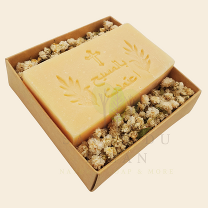 Bloom & Bless Baptism Set: Stamped Artisanal Lebanese Soap along with Dried Flowers in 8x8x2.50 cm kraft with Transparent Lid. Soap in Arabic "بالمسيح اعتمدت"