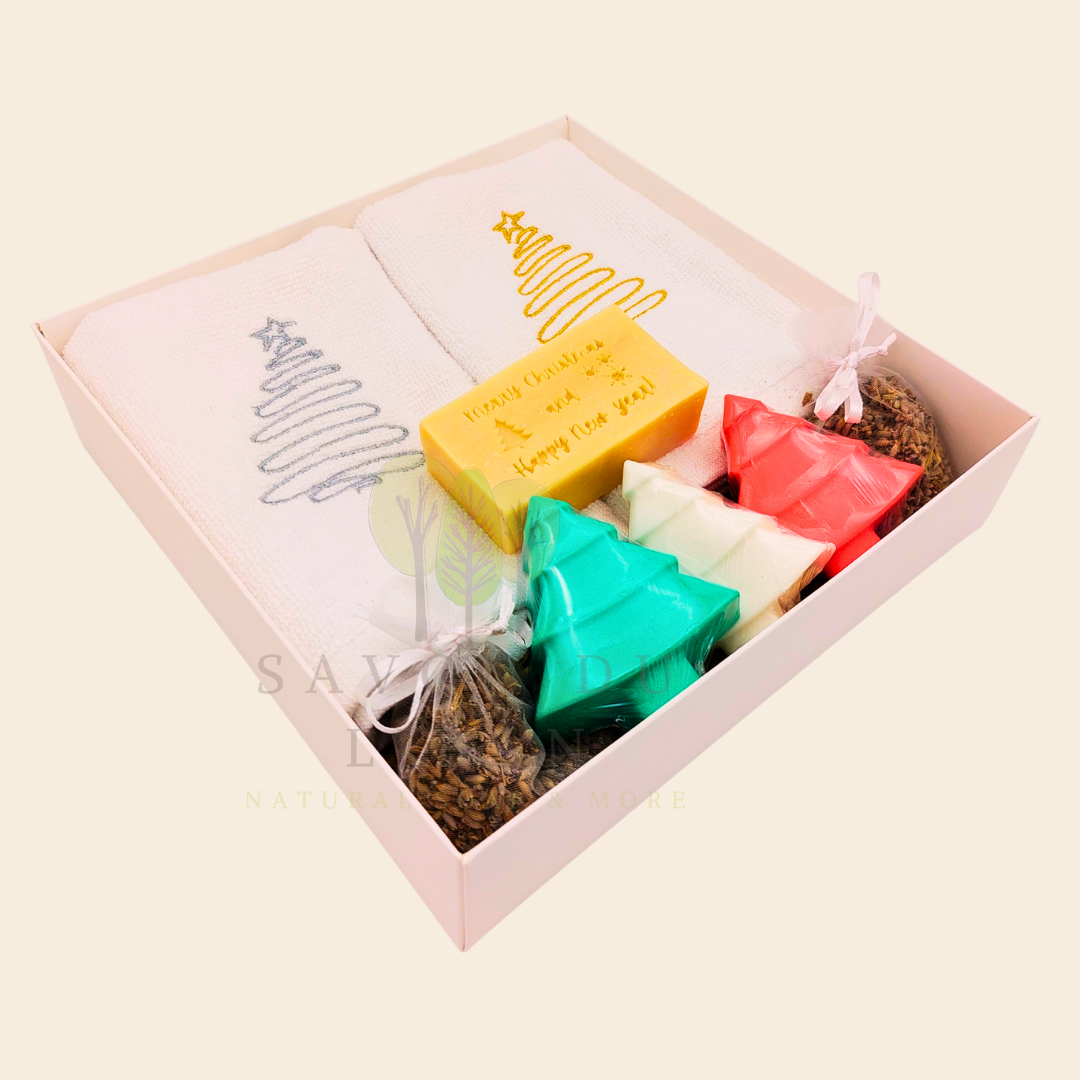 Trésor de Noël Christmas gift set with embroidered towels, Christmas Tree soaps, lavender sachets, and engraved musk soap