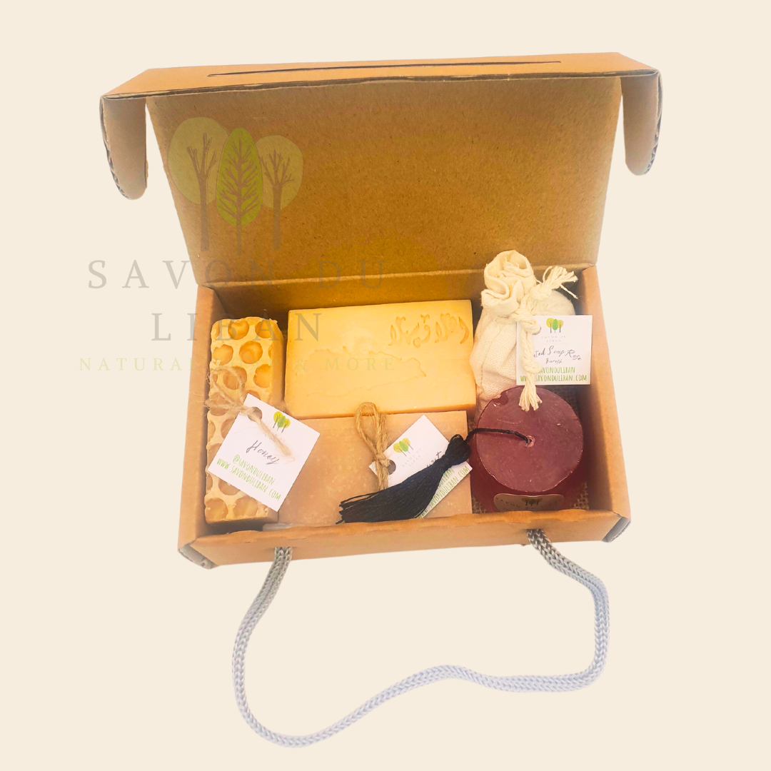 Tradition’s Touch gift box with Lebanese soaps and ribbon handle. Handmade by Savon Du Liban, it includes engraved soap, 2 soap bars, a tarboosh soap and a grated soap bag, all in kraft box with handle.