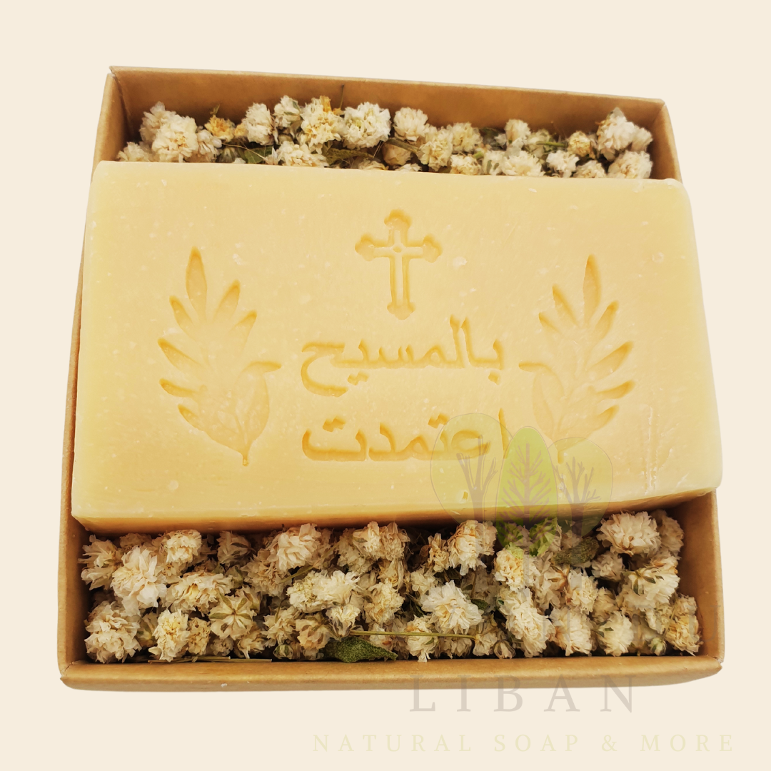 Bloom & Bless Baptism Set: Stamped Artisanal Lebanese Soap along with Dried Flowers in 8x8x2.50 cm kraft with Transparent Lid. Soap in Arabic "بالمسيح اعتمدت"