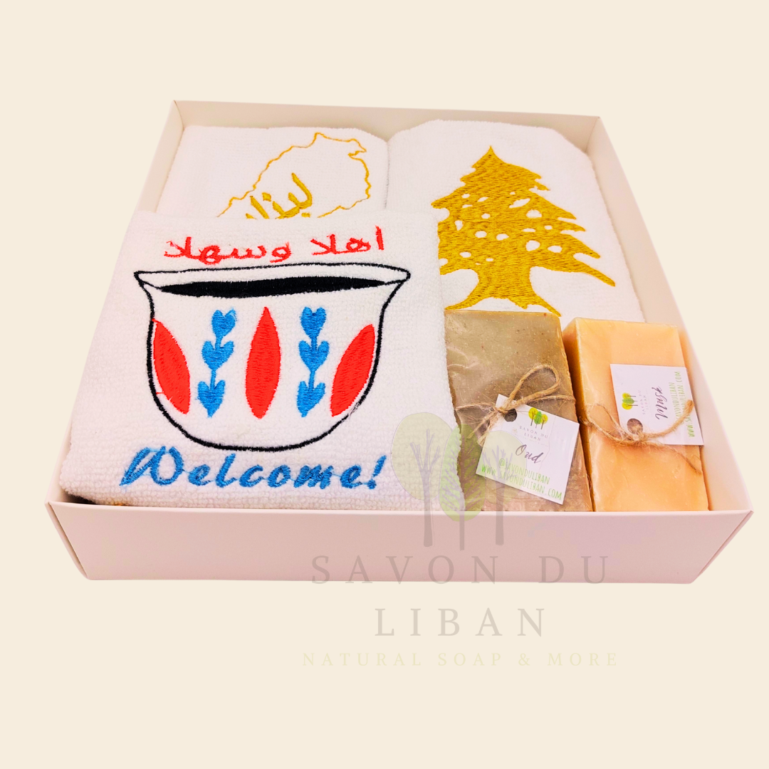 Good Morning from Lebanon – cultural gift set including embroidered towels with Cedar Tree, Lebanon Map, and Coffee Cup Motifs and 2 Handmade Soap Bars in a square white box with transparent lid.