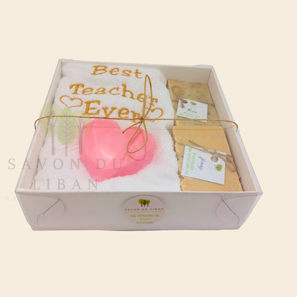 "Teacher's Fabulous Box" gift set with a 30x30 cm towel embroidered with 'Best Teacher Ever' and soaps (including a heart-shaped soap) in a box with a transparent cover. Handmade in Lebanon by Savon Du Liban for Teacher's Day.