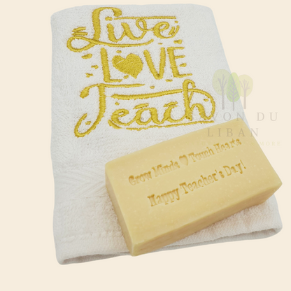 Teacher's Tribute Bag with an embroidered towel, stamped musk soap with the message 'Grow Minds ❤️ Touch Hearts - Happy Teacher's Day!, in an organza bag.