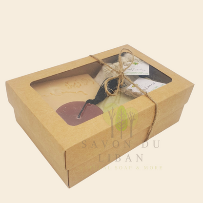 Timeless Charms of Lebanon soap gift set with grated soap, extra laurel soap bar, a tarboosh soap, and a musk soap stamped with Lebanon's Map & Ahla w Sahla in Arabic. Box with closed lid.