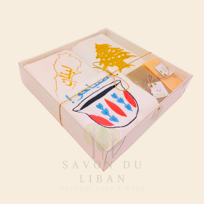 Good Morning from Lebanon – cultural gift set including embroidered towels with Cedar Tree, Lebanon Map, and Coffee Cup Motifs and 2 Handmade Soap Bars in a square white box with transparent lid.