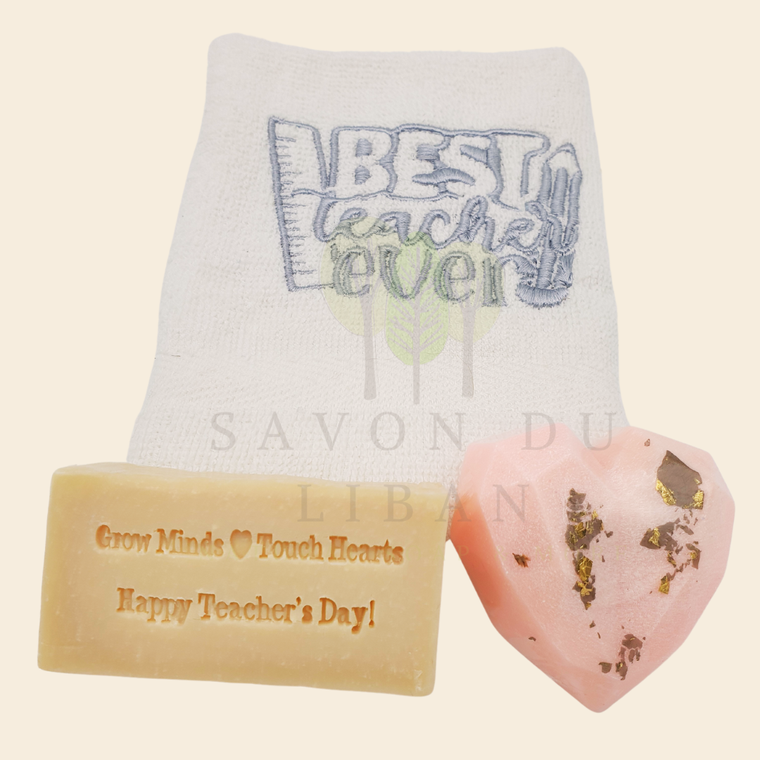 Teacher's Tribute Bag with an embroidered towel, stamped musk soap with the message 'Grow Minds ❤️ Touch Hearts - Happy Teacher's Day!, and optional heart soap in an organza bag.