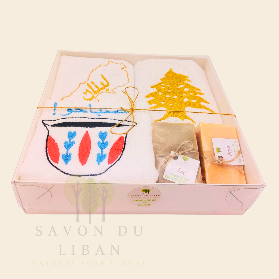 Good Morning from Lebanon – cultural gift set including embroidered towels with Cedar Tree, Lebanon Map, and Coffee Cup Motifs and 2 Handmade Soap Bars in a square white box with transparent lid.
