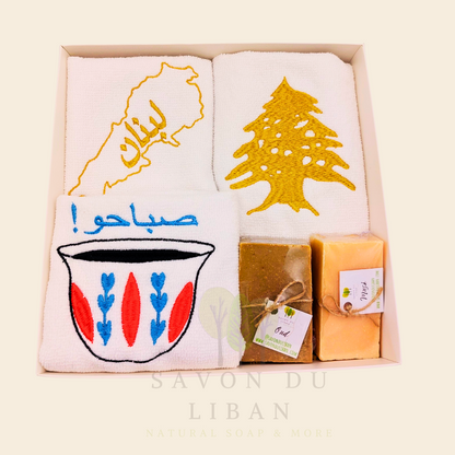 Good Morning from Lebanon – cultural gift set including embroidered towels with Cedar Tree, Lebanon Map, and Coffee Cup Motifs and 2 Handmade Soap Bars in a square white box with transparent lid.
