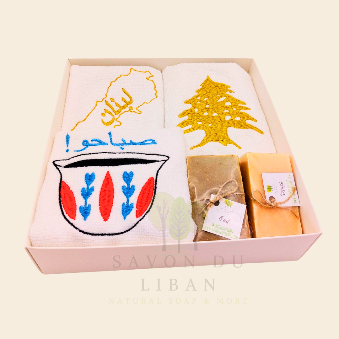 Good Morning from Lebanon – cultural gift set including embroidered towels with Cedar Tree, Lebanon Map, and Coffee Cup Motifs and 2 Handmade Soap Bars in a square white box with transparent lid.
