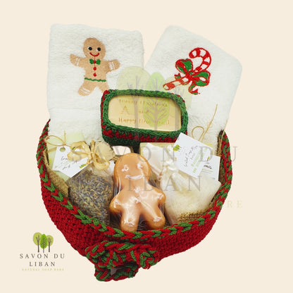 Ginger-fied Crochet Basket with festive embroidered towels and holiday-themed soaps (Gingerbread man-shaped soap).