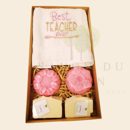 "Petals, Stitches & Bubbles Teacher’s Treat" gift set for Teacher's Day 2025 with embroidered towel and pink flower soaps in a rustic kraft box (30 x 17 x 4 cm).