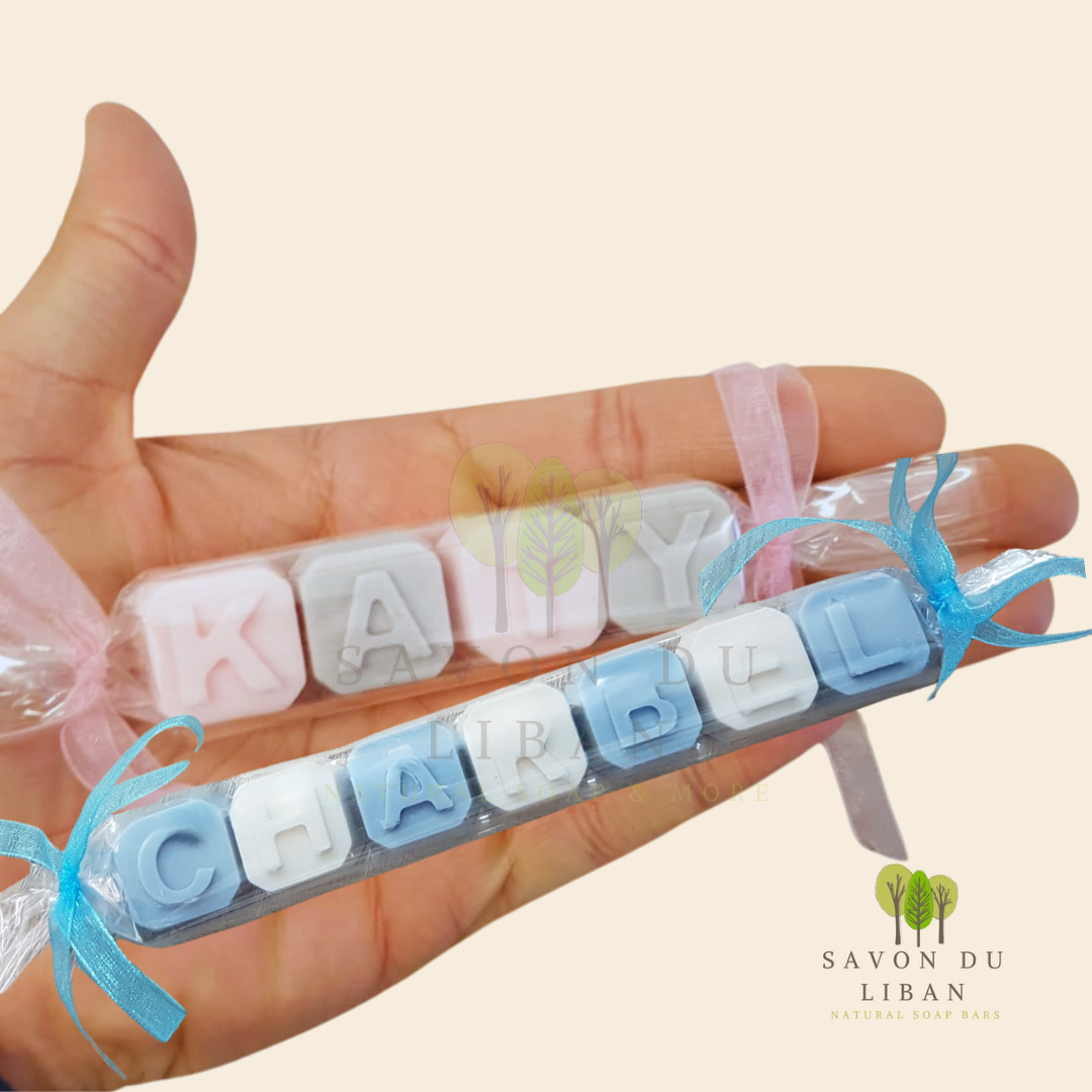 Assorted personalized soap letters in various colors by Savon Du Liban