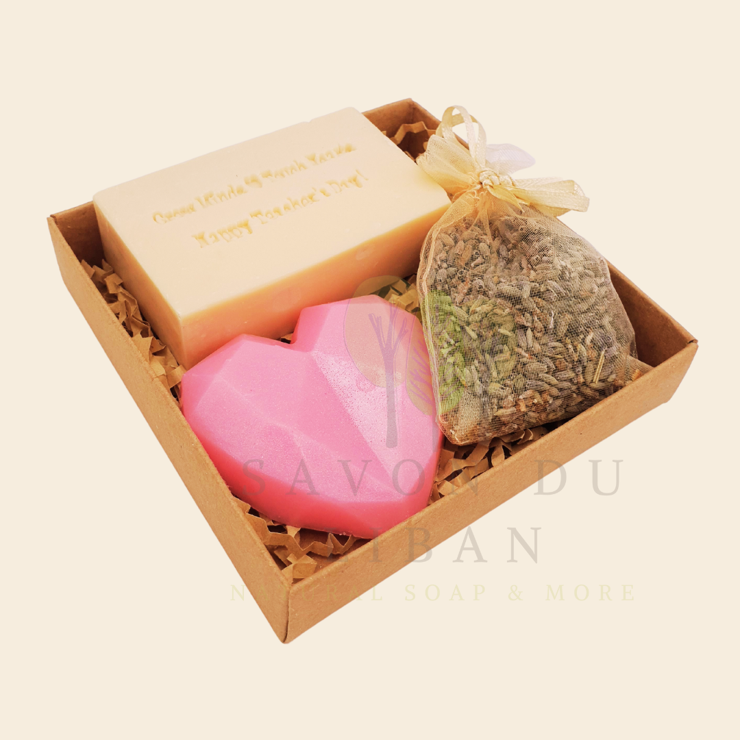 Teacher’s Relax & Enjoy Set – Stamped soap 'Grow Minds ❤️ Touch Hearts - Happy Teacher's Day!', heart soap, and lavender bag in a 11x11x2.5 cm craft box with transparent cover.