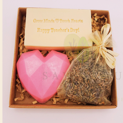 Teacher’s Relax & Enjoy Set – Stamped soap 'Grow Minds ❤️ Touch Hearts - Happy Teacher's Day!', heart soap, and lavender bag in a 11x11x2.5 cm craft box with transparent cover.