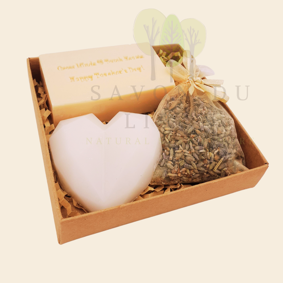 Teacher’s Relax & Enjoy Set – Stamped soap 'Grow Minds ❤️ Touch Hearts - Happy Teacher's Day!', heart soap, and lavender bag in a 11x11x2.5 cm craft box with transparent cover.